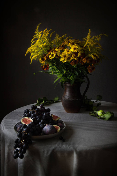 Sill-life with fruits and flowers at the Lesser Dutchmen style. Dark tones,selective focus. - Fotoğraf, Görsel
