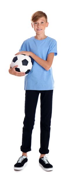 Portrait of young boy holding soccer ball on white background - Photo, image
