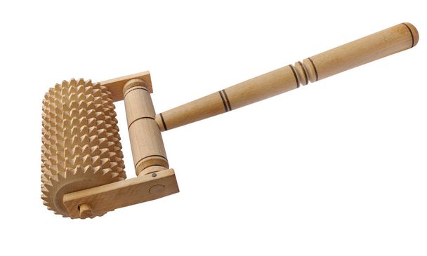 Gear massage roller made of wood on a white background - Fotó, kép