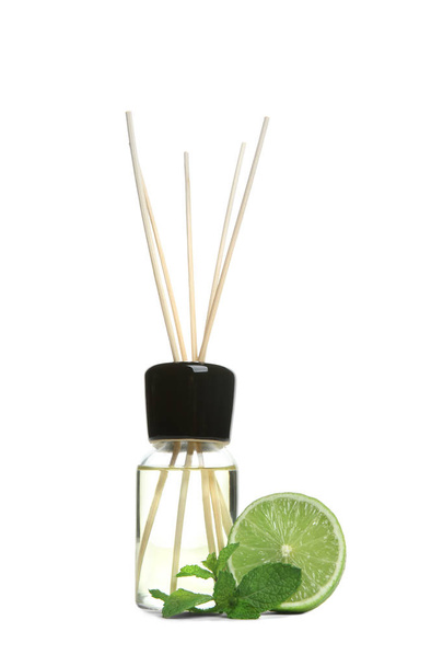 Aromatic reed air freshener and lime on white background - Photo, Image