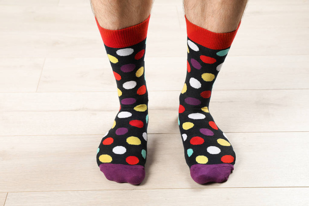 Man in stylish socks on floor, closeup - Photo, Image