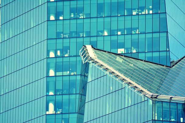 Modern office building on a clear sky background. Retro stylized colorful tonal filter effect - Photo, Image