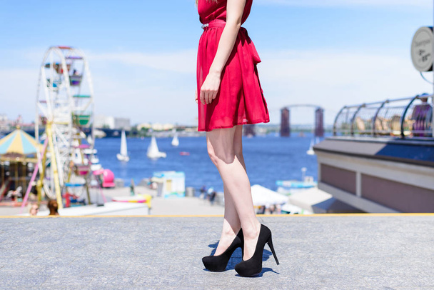 Street town center prom seaside floor lifestyle concept. Side profile close up view photo portrait of attractive sexy fit slim long pretty lady's legs in black suede foot-wear blurred background - Photo, Image