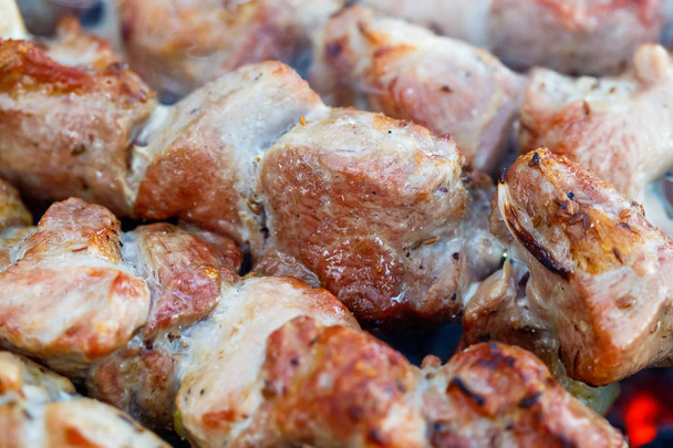 Barbecue skewers with meat on the brazier. Grill pork shish kebab - 写真・画像