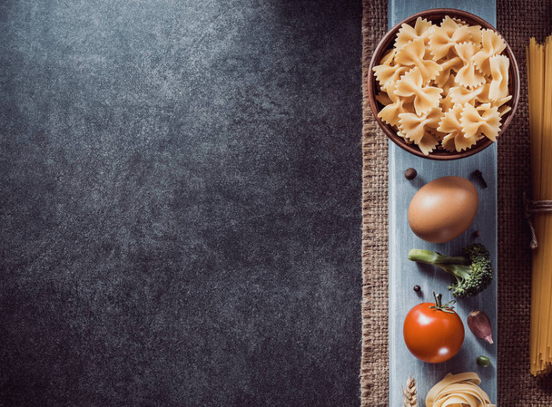 pasta and food ingredient on dark background - Foto, immagini