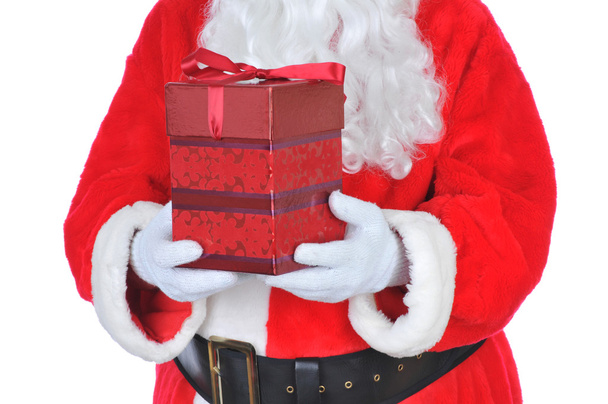 Santa Claus sosteniendo presente
 - Foto, Imagen