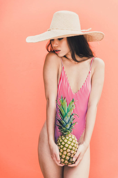 Beautiful asian young woman with bikini. Portraits on colored backgrounds - Zdjęcie, obraz