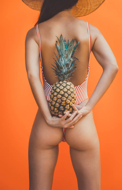 Beautiful asian young woman with bikini. Portraits on colored backgrounds - Фото, зображення