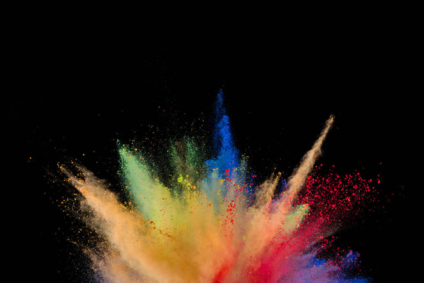 Explosión de polvo de color aislado sobre fondo negro. Fondo de color abstracto
 - Foto, imagen