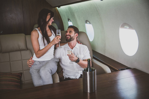 Couple on vacation, flying on their private jet - Foto, immagini