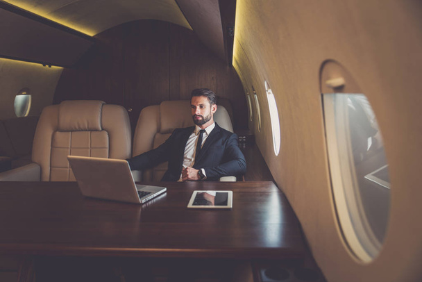 Businessman flying on his private jet - Foto, Imagem