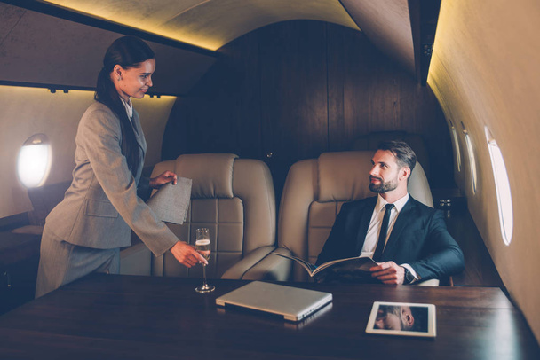 Businessman flying on his private jet - Foto, immagini