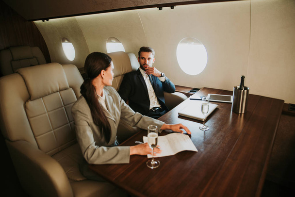 Business team on the private jet - Foto, Imagem
