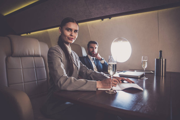 Business team on the private jet - Foto, immagini