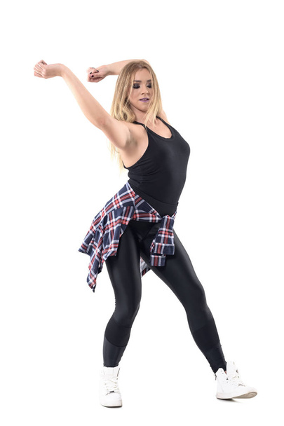Energetic jazz dance female dance instructor swinging arms behind head with closed eyes. Full body length portrait isolated on white background. - Φωτογραφία, εικόνα