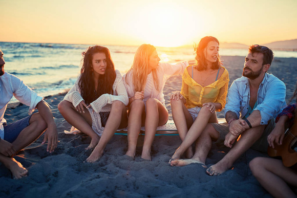 Group of happy young friends having a great time together at the beach - 写真・画像