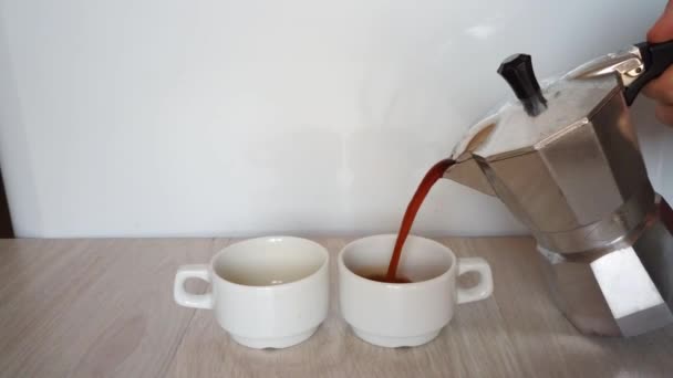 Moka pot and pouring coffee - Felvétel, videó