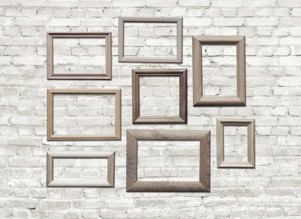 old photo frames on brick wall - Фото, зображення