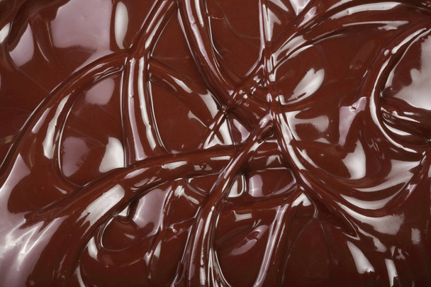 Stopiony czekolada wirowa jako tło zbliżenie - Zdjęcie, obraz