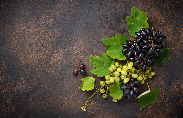 Assortment of  grapes with leaves  - Photo, Image
