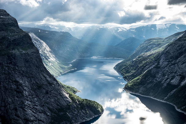 Beautiful fjord in Norway with amazing sun rays. View from the top - Foto, imagen