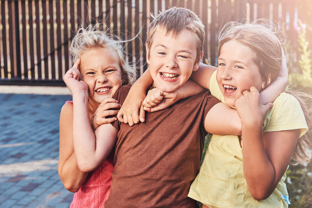 Close-up portrait of happy little friends having fun at yard. - Φωτογραφία, εικόνα