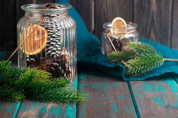 Dried citrus in glass jar. Fir branches and christmas toys. Christmas gift box. Rustic style christmas. - Foto, Imagem
