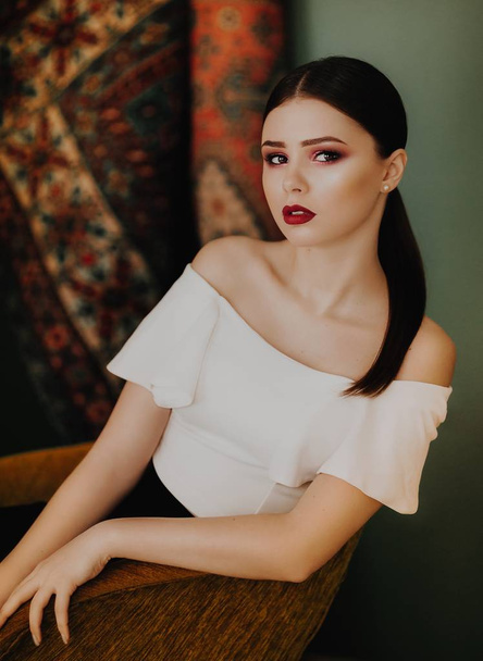 Portrait of beautiful young brunette woman with makeup - Photo, Image