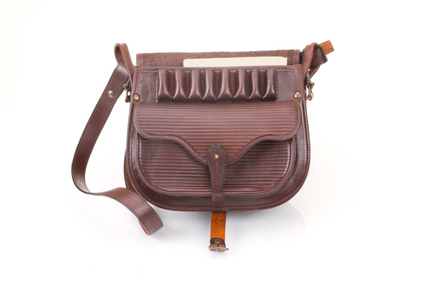 Leather hunting bag with brown ornament with patronage on white isolated background. - Photo, Image
