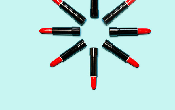 Set of red lipstick isolated equalled a circle on blue color background. Colorful Tones, Lipstick tints palette, Makeup and Beauty. Beautiful Make-up concept. lipgloss. - Photo, Image