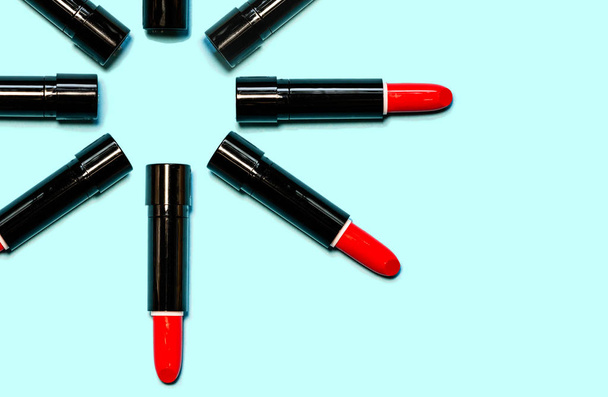 Set of red lipstick isolated equalled a circle on blue color background. Colorful Tones, Lipstick tints palette, Makeup and Beauty. Beautiful Make-up concept. lipgloss. - Foto, Imagen