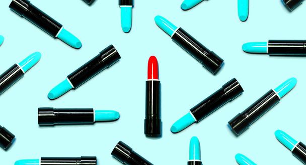 Set of blue lipsticks with red in the center isolated on blue color background. Colorful Tones, Lipstick tints palette, Makeup and Beauty. Beautiful Make-up concept. lipgloss. - Foto, Imagen