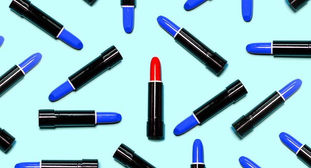 Set of dark blue lipsticks with red in the center isolated on blue color background. Colorful Tones, Lipstick tints palette, Makeup and Beauty. Beautiful Make-up concept. lipgloss. - Photo, image