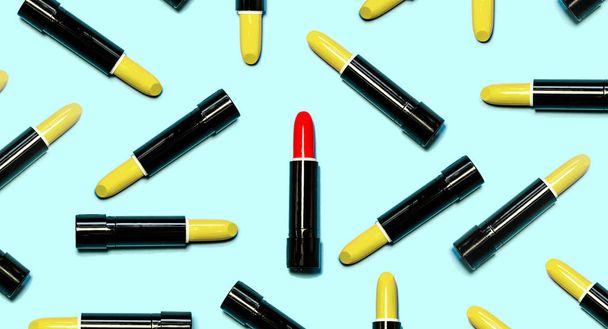 Set of yellow lipsticks with red in the center isolated on blue color background. Colorful Tones, Lipstick tints palette, Makeup and Beauty. Beautiful Make-up concept. lipgloss. - Foto, Imagen