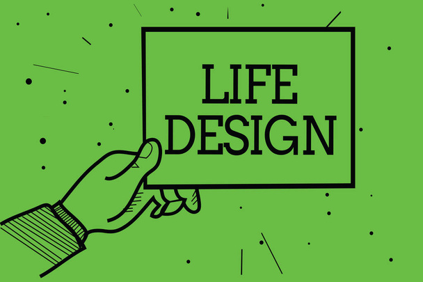 Text sign showing Life Design. Conceptual photo balance how you live between work family and entertaining Man hand holding paper communicating information dotted green background - Photo, Image