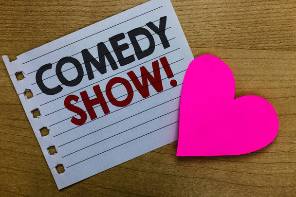 Conceptual hand writing showing Comedy Show. Business photo showcasing Funny program Humorous Amusing medium of Entertainment Notebook paper Romantic ideas heart feelings Wooden table - Photo, Image