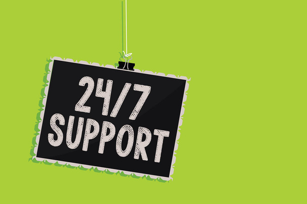 Conceptual hand writing showing 24 7 Support. Business photo text Giving assistance to service whole day and night No downtime Hanging blackboard message communication sign green background - Photo, Image
