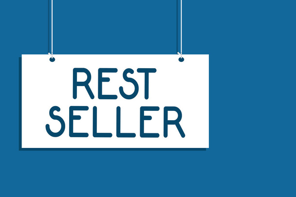 Text sign showing Rest Seller. Conceptual photo one feature or the perceived benefit good which makes it unique Hanging board communicate information open close sign blue background - Photo, Image