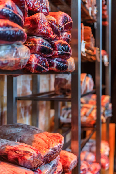 Dry aged wagyu beef and bison on display in restaurant or butcher meat shop - Foto, Imagem
