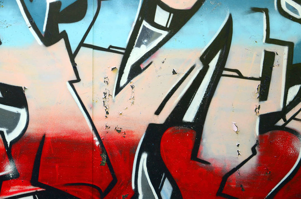 Фрагмент граффити рисунков. Старая стена декорирована краской в стиле уличного искусства. Цветная текстура фона
. - Фото, изображение