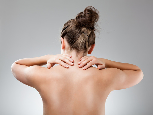 Woman massaging pain back isolated on white background - Photo, Image