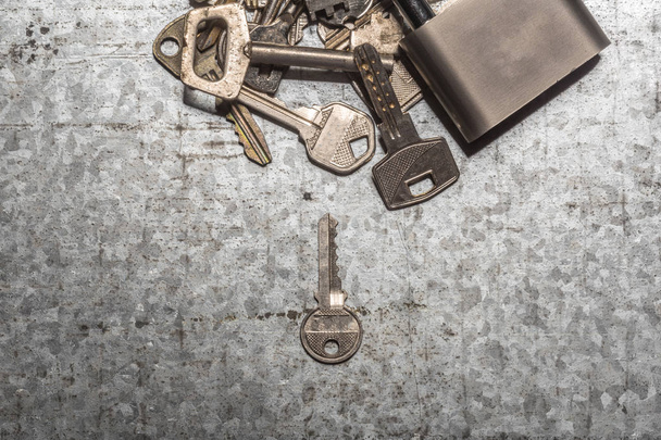 Old keys on grey background - 写真・画像