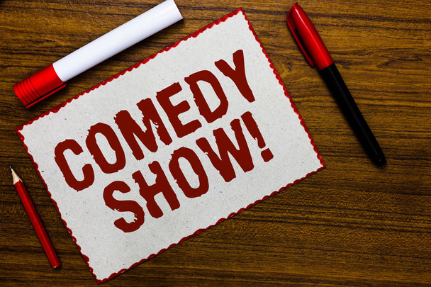 Handwriting text writing Comedy Show. Concept meaning Funny program Humorous Amusing medium of Entertainment White paper red borders markers wooden background communicating ideas - Photo, Image