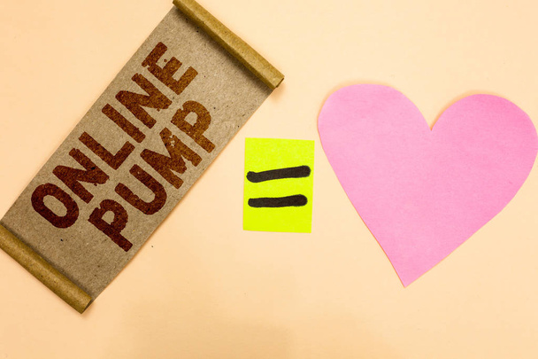 Writing note showing Online Pump. Business photo showcasing device which moves liquid from lower level to higher one Piece fabric reminder equal sign pink heart sending romantic message - Photo, Image