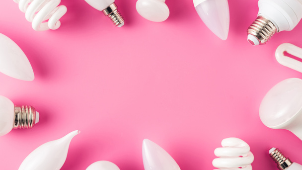 top view of various light bulbs on pink, energy concept  - Foto, afbeelding