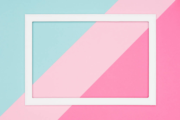Abstract geometrical pastel blue, teal and pink paper flat lay background. Minimalism, geometry and symmetry template with empty picture frame mock up. - Foto, Bild