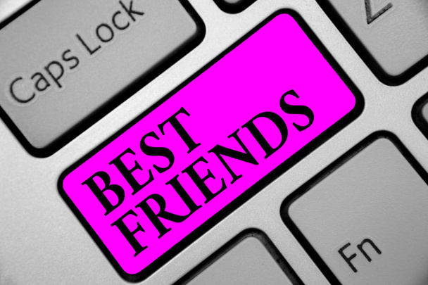 Writing note showing Best Friends. Business photo showcasing A person you value above other persons Forever buddies Keyboard purple key Intention computer computing reflection document - Photo, Image