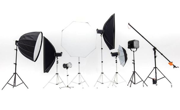 Flash studios of various sizes and accessories are placed together on a white background. - Photo, Image