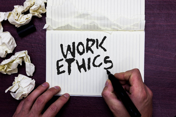 Word writing text Work Ethics. Business concept for A set of values centered on the importance of doing work Man holding marker notebook page crumpled papers several tries mistakes - Photo, Image