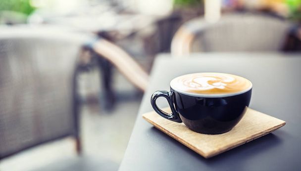 Coffee and latte art on table terrace in restaurant. - Valokuva, kuva